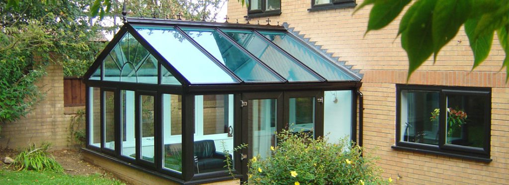 A 6x4 new conservatory installation shown with black upvc